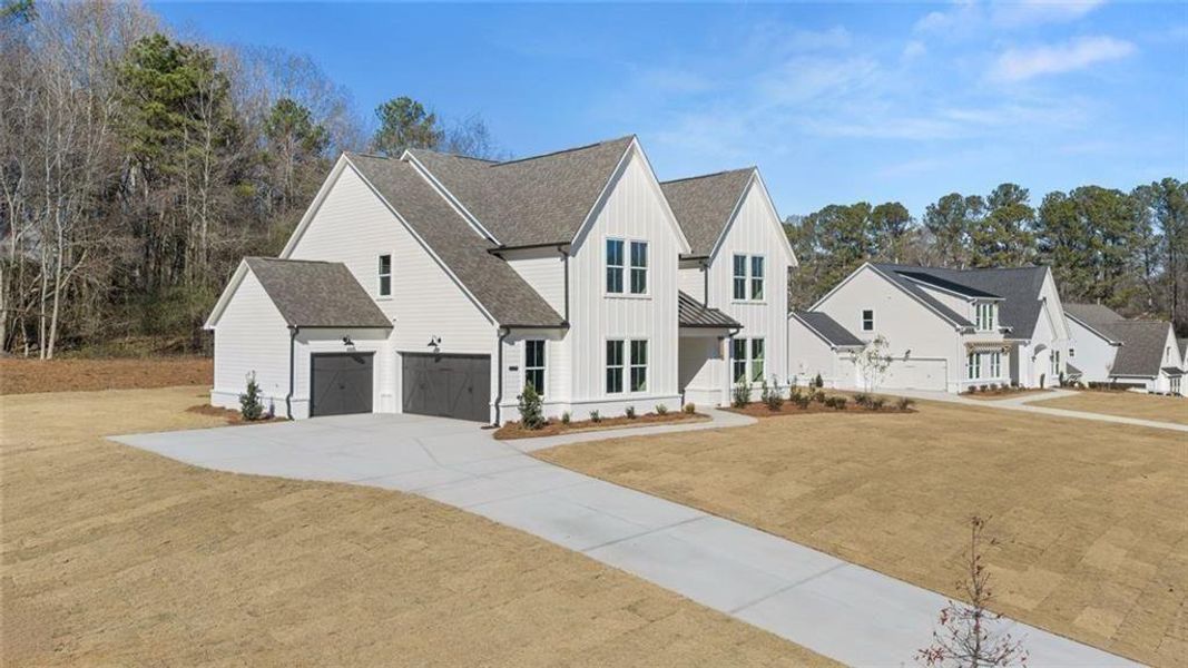 Front exterior of a new home in , Gainesville, GA, highlighting curb appeal (Image 2). Front exterior of a new home in , Gainesville, GA, highlighting curb appeal (Image 2).