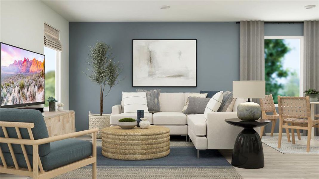 Living room featuring hardwood / wood-style floors and a healthy amount of sunlight