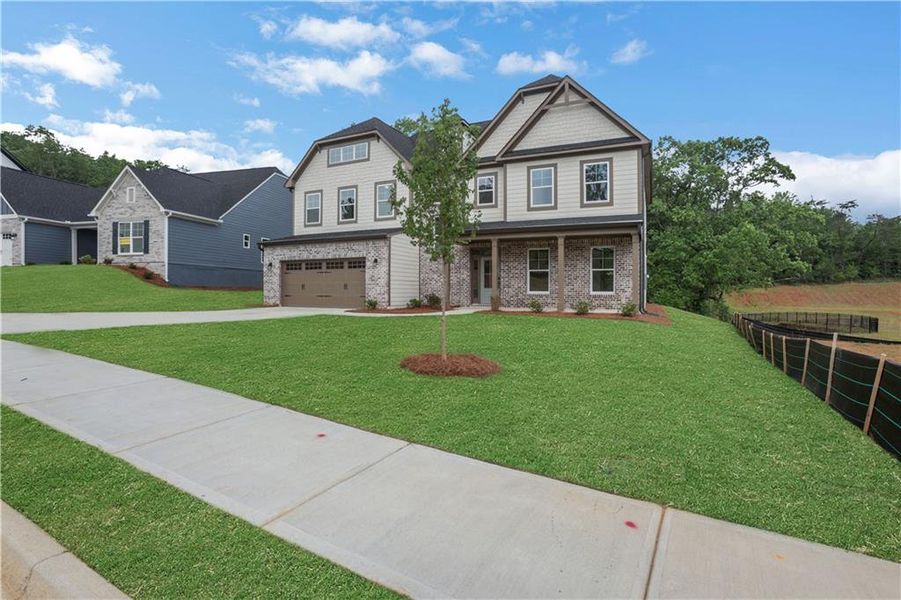 Front exterior of a new home in Arbor West, Dawsonville, GA, highlighting curb appeal (Image 28).