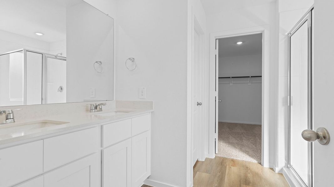 Furnished interior view inside a new home in Caldwell Crossing, Iowa Colony (Image 9).