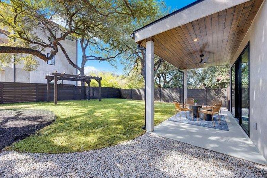 This yard will blow you away! The canopy of mature oaks offer shade. Room for a pool, cold plunge, tossing a ball and hanging out unter the covered patio. The 8' x 14' pergola with swing awaits you day or night.