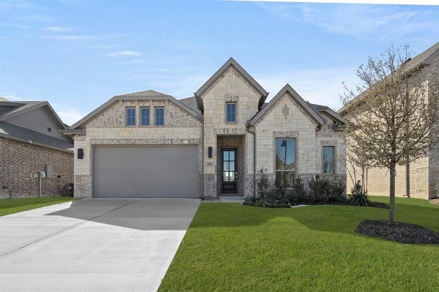 Front exterior of a new home in The Retreat, Waxahachie, TX, highlighting curb appeal (Image 2). Front exterior of a new home in The Retreat, Waxahachie, TX, highlighting curb appeal (Image 2).