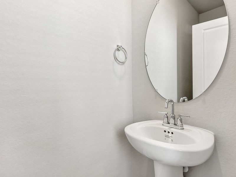 The first-floor powder bathroom is very convenient for guests.