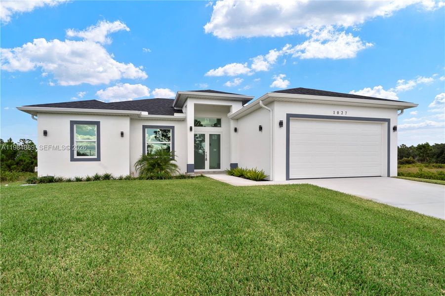 Front exterior of a new home in , Lehigh Acres, FL, highlighting curb appeal (Image 26).