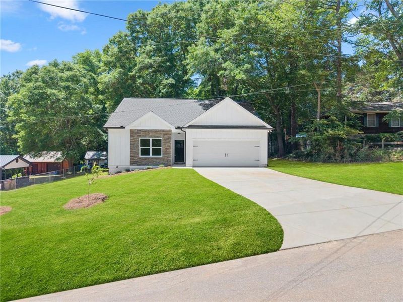 Front exterior of a new home in , Jefferson, GA, highlighting curb appeal (Image 17).