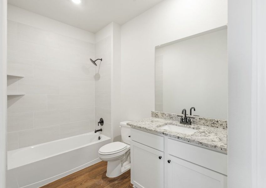 Secondary bathroom with a shower/tub combination