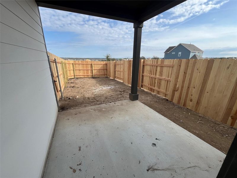 Exterior details and patio area of a home in The Cottages at Lariat, Liberty Hill (Image 2).