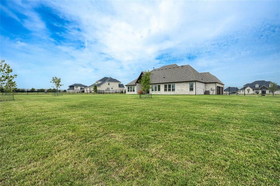 Back of property featuring brick siding