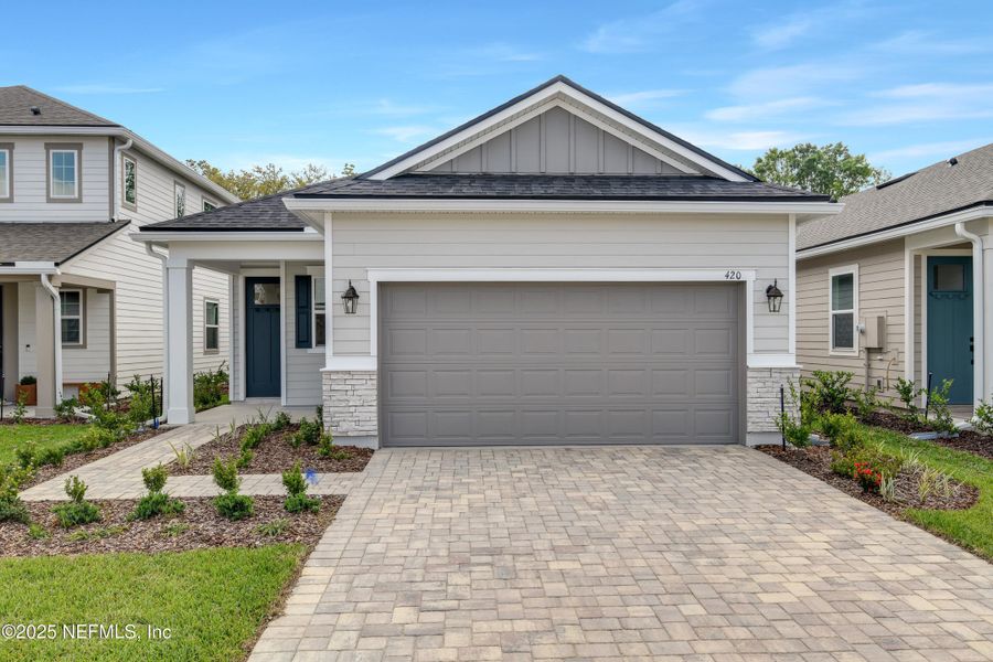 Front exterior of a new home in Elm Creek at Silverleaf, St. Augustine, FL, highlighting curb appeal (Image 11). Front exterior of a new home in Elm Creek at Silverleaf, St. Augustine, FL, highlighting curb appeal (Image 11).