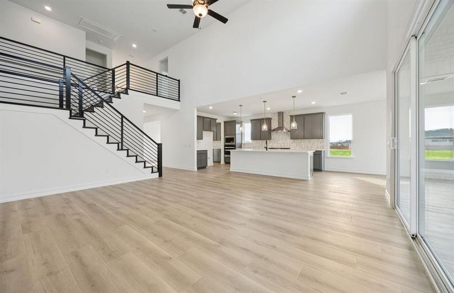 Spacious gathering room with large windows *Model Representation*