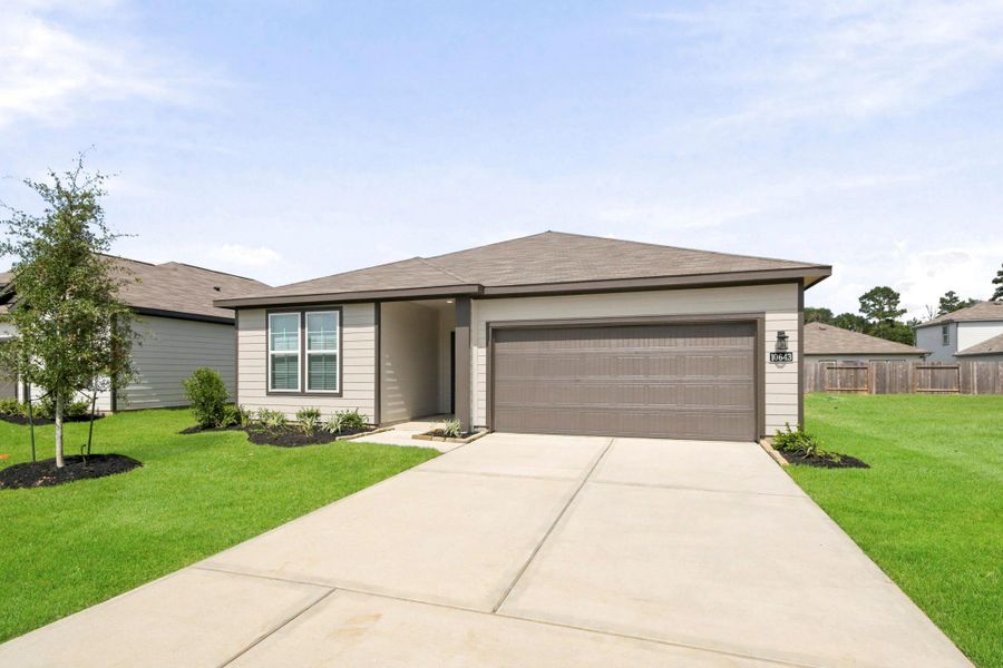 Front exterior of a new home in Crockett Meadows, Conroe, TX, highlighting curb appeal (Image 2). Front exterior of a new home in Crockett Meadows, Conroe, TX, highlighting curb appeal (Image 2).