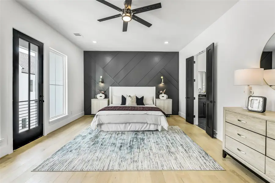 Designed as a peaceful retreat, the primary suite features a dramatic custom millwork accent wall, wide-plank white oak flooring, and soaring ceilings with recessed lighting. Natural light pours in through oversized energy-efficient windows and French doors that open to a private balcony. Ideal for medical professionals seeking calm and restoration after long hours, this space perfectly blends serenity and style. Designed as a peaceful retreat, the primary suite features a dramatic custom millwork accent wall, wide-plank white oak flooring, and soaring ceilings with recessed lighting. Natural light pours in through oversized energy-efficient windows and French doors that open to a private balcony. Ideal for medical professionals seeking calm and restoration after long hours, this space perfectly blends serenity and style.