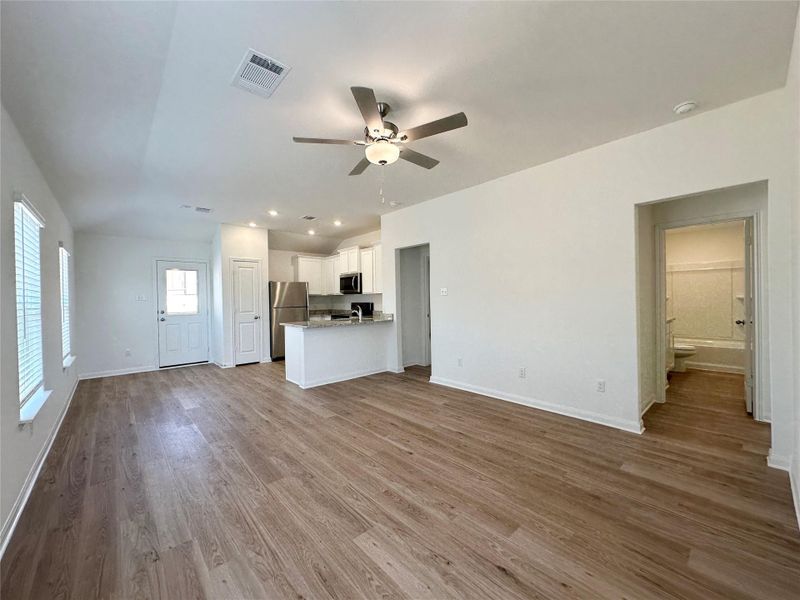 The kitchen overlooks the living room and dining area so that you never miss a beat as you prep your next meal. The kitchen overlooks the living room and dining area so that you never miss a beat as you prep your next meal.
