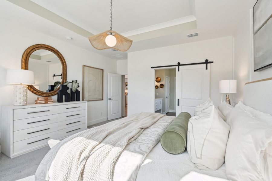 Primary suite with sliding barn door to private bath Primary suite with sliding barn door to private bath