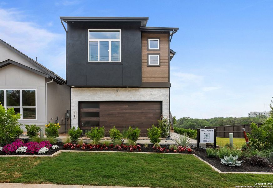 Front exterior of a new home in Prominence – Now Selling, San Antonio, TX, highlighting curb appeal (Image 1).