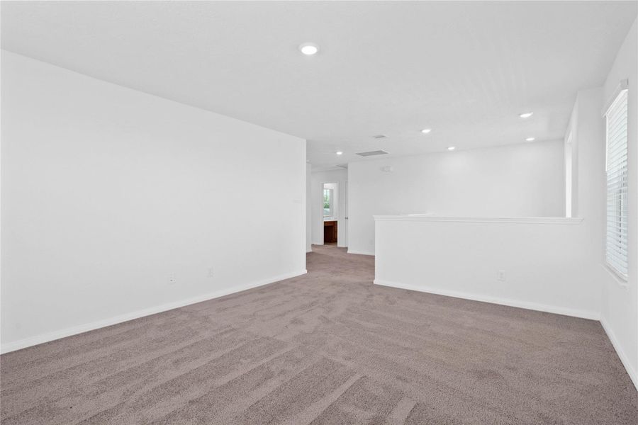 Additional view from the Loft looking towards the hallway leading to the secondary bathroom and bedrooms. Additional view from the Loft looking towards the hallway leading to the secondary bathroom and bedrooms.