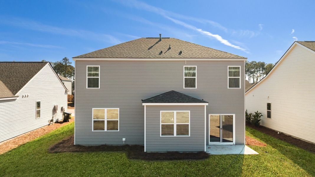 Exterior details and patio area of a home in Pine Hills at Cane Bay, Summerville (Image 3).