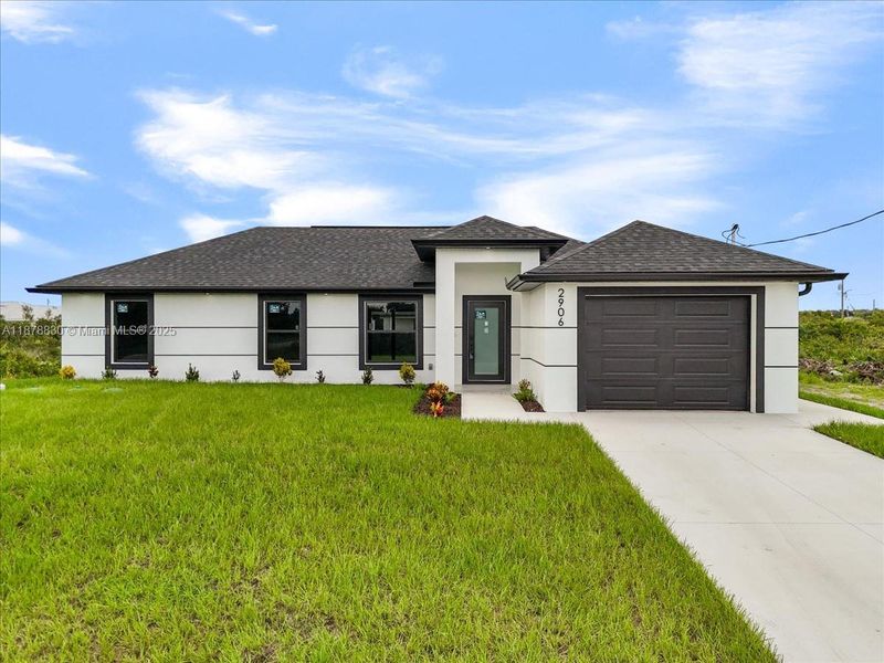 Front exterior of a new home in , Lehigh Acres, FL, highlighting curb appeal (Image 23).