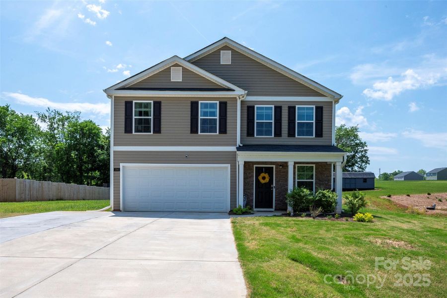 Front exterior of a new home in , Lexington, NC, highlighting curb appeal (Image 20).