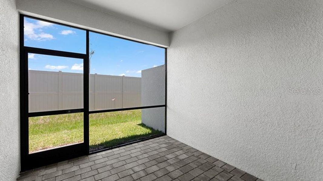 Exterior details and patio area of a home in Palm Lake at Coco Bay, Englewood (Image 2).