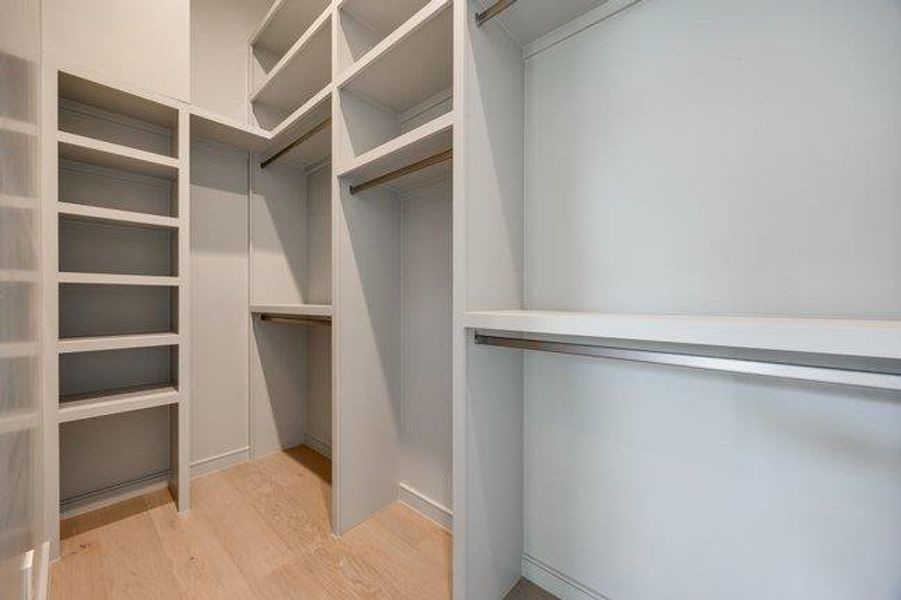 Owners walk-in closet feature built shelving and racks. 10 ft ceiling with lots of room to spread out.