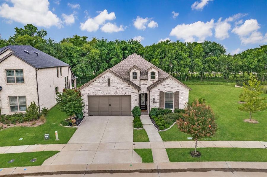 Front exterior of a new home in Mantua Point, Van Alstyne, TX, highlighting curb appeal (Image 24).