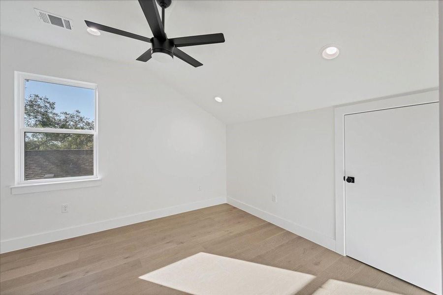 Third bedroom upstairs features a sloping ceiling and tons of light!