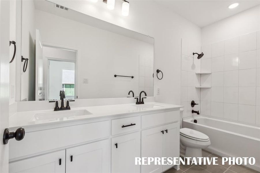 Guest will enjoy their own vanity space in this lovely guest bath.  REPRESENTATIVE PHOTO