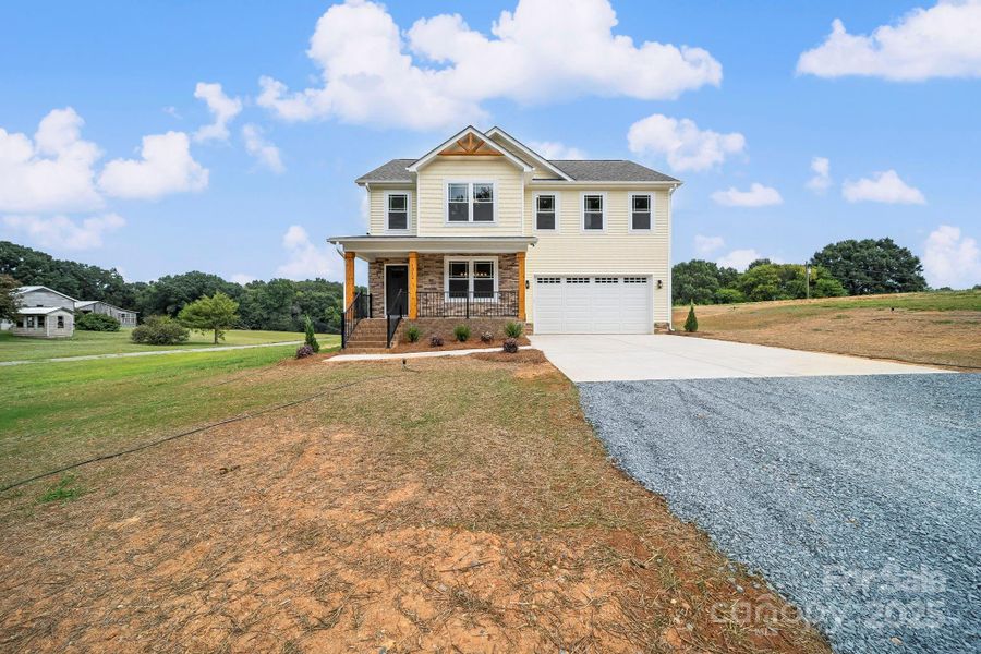 Front exterior of a new home in , Wingate, NC, highlighting curb appeal (Image 19).