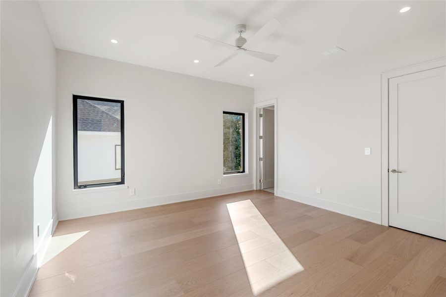 Spacious secondary bedrooms with ensuite baths and closets detailed with drawers and hanging space. NOTE: This photo is a rendering of one of the builder’s prior homes and similarly used as an example for this home. Please contact the listing agent to tour this property and for more detailed information.