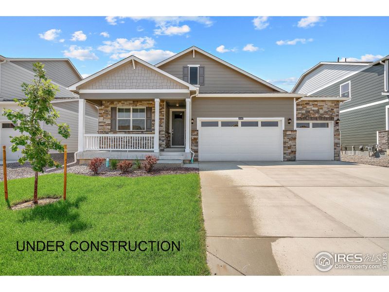 Front exterior of a new home in Hansen Farm, Fort Collins, CO, highlighting curb appeal (Image 1).