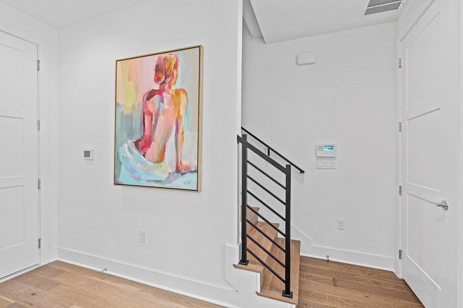 Entryway with baseboards and light wood-type flooring