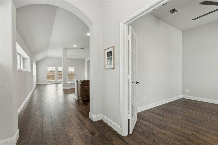 Beautiful luxury vinyl wood like flooring throughout the entry, study, kitchen, dining and living area.