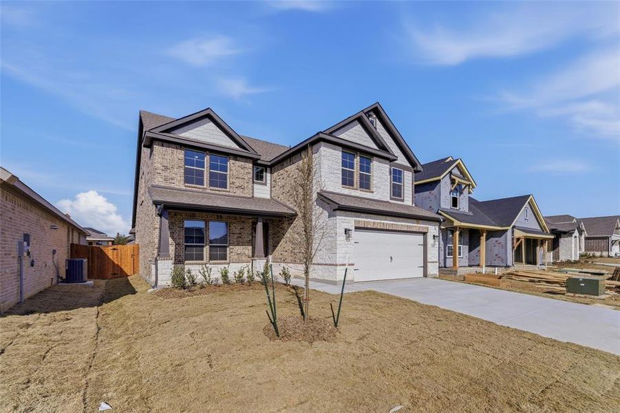 Front exterior of a new home in Liberty Pointe, Gainesville, TX, highlighting curb appeal (Image 16).