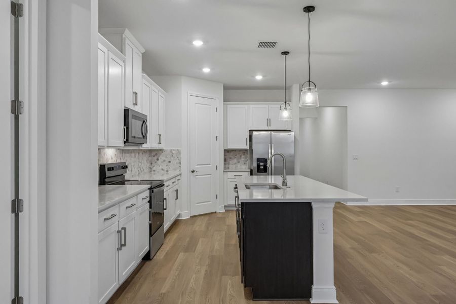 Furnished interior view inside a new home in Legends Preserve - Signature Series, Daytona Beach (Image 4).
