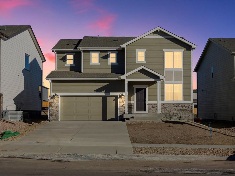Front exterior of a new home in Meridian Ranch, Peyton, CO, highlighting curb appeal (Image 1). Front exterior of a new home in Meridian Ranch, Peyton, CO, highlighting curb appeal (Image 1).