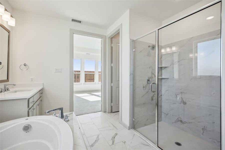 Your beautiful new owner's bath features a spacious walk in shower and a luxurious soaking tub!