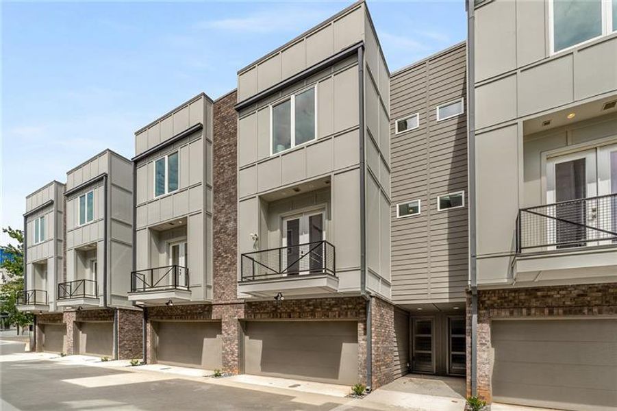 Front exterior of a new home in Maynard Terrace Townhomes, Atlanta, GA, highlighting curb appeal (Image 26). Front exterior of a new home in Maynard Terrace Townhomes, Atlanta, GA, highlighting curb appeal (Image 26).