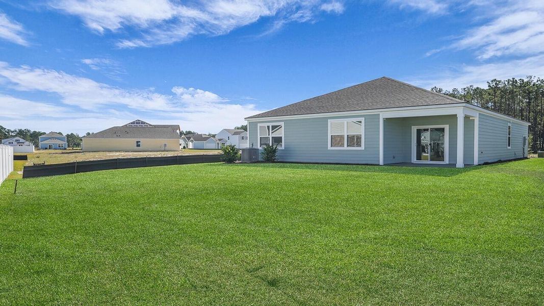 Exterior details and patio area of a home in Hillcrest, Ravenel (Image 3). Exterior details and patio area of a home in Hillcrest, Ravenel (Image 3).