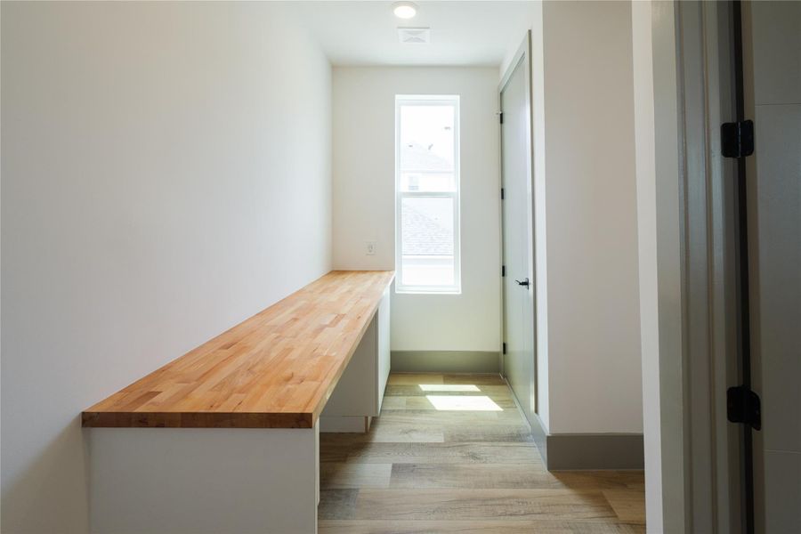 Representative Kitchenette View (Design selections and colors may vary):  Embedded into the first level bedroom, this kitchenette maximizes functionality and space and can accomodate for varied cooking and dining needs along with enough space for washer/dryer unit if desired.