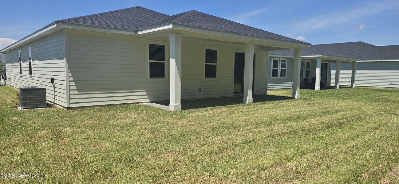 Front exterior of a new home in Colbert Landings, Palm Coast, FL, highlighting curb appeal (Image 19).