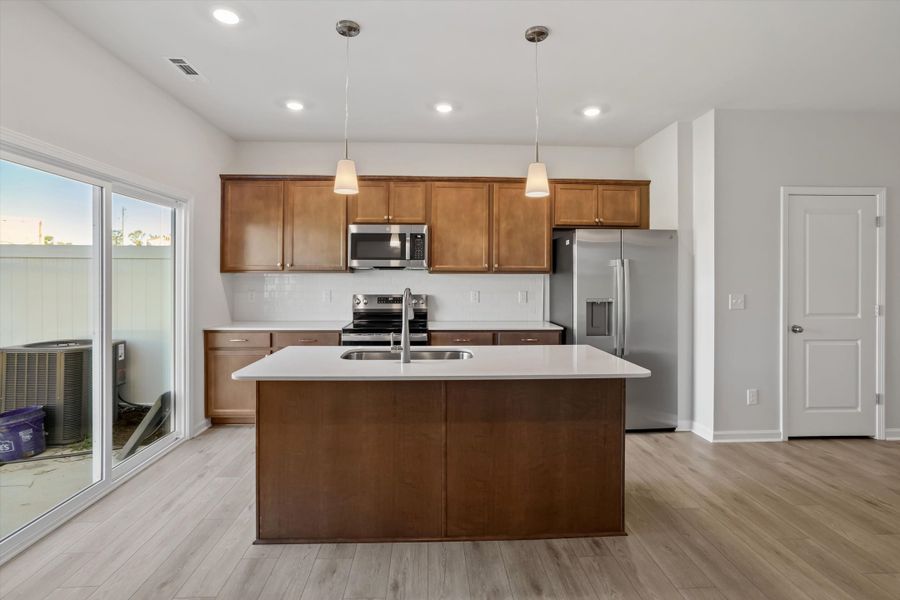Furnished interior view inside a new home in West Main Townhomes, Sanford (Image 7).