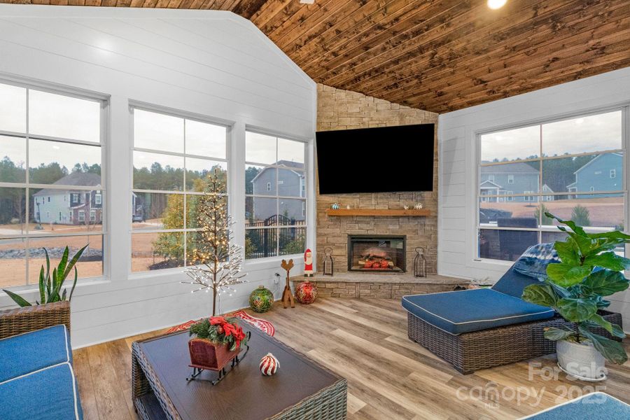 Climate controlled sunroom with electric fireplace and easy breeze windows