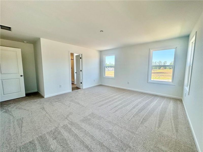 Spacious, unfurnished interior of a new home in Eastlyn Crossing, Flowery Branch (Image 29).