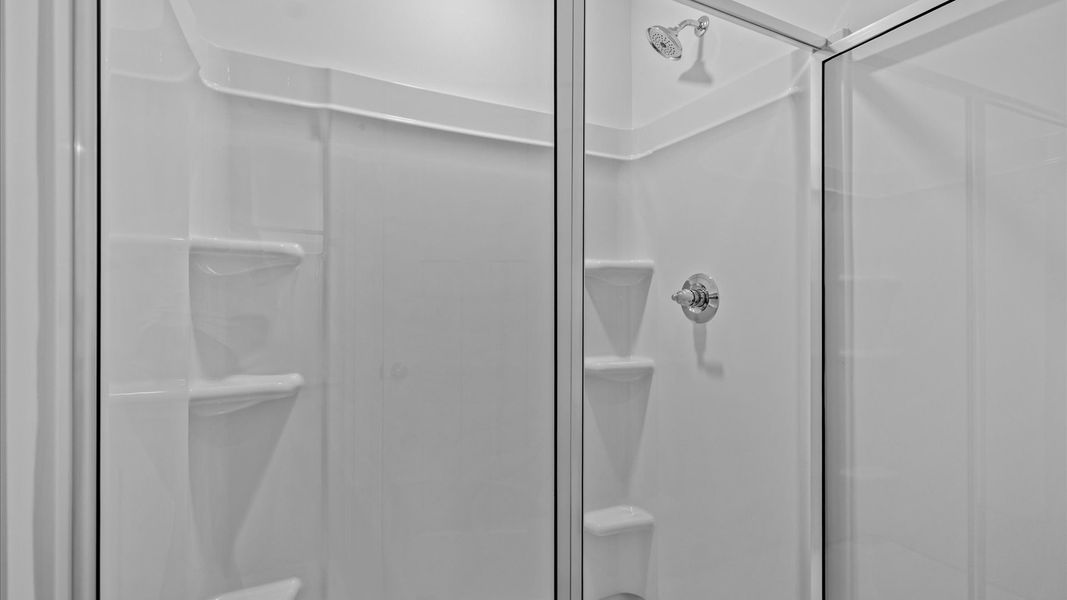 First-rate primary bathroom offering an elegant walk-in shower and dual sinks with superior style First-rate primary bathroom offering an elegant walk-in shower and dual sinks with superior style