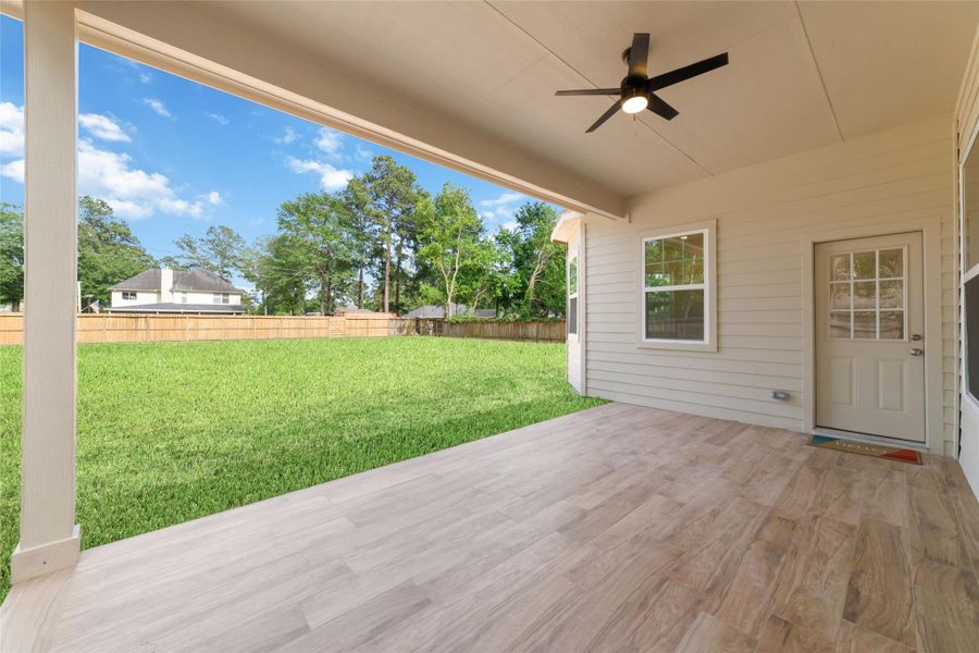 Relax at the end of the day on this expansive covered patio looking over the enormous backyard. Relax at the end of the day on this expansive covered patio looking over the enormous backyard.