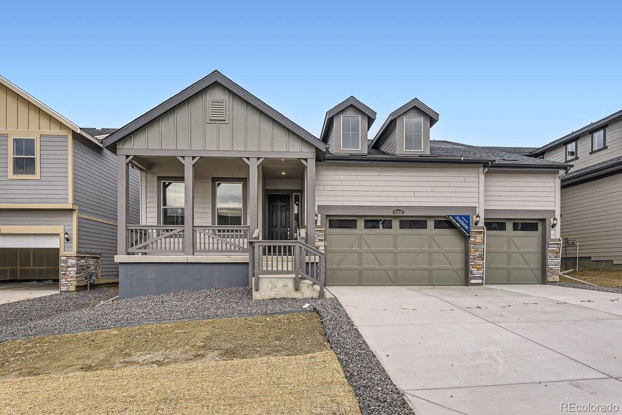 Front exterior of a new home in Red Rocks Ranch: The Grand Collection, Morrison, CO, highlighting curb appeal (Image 1).