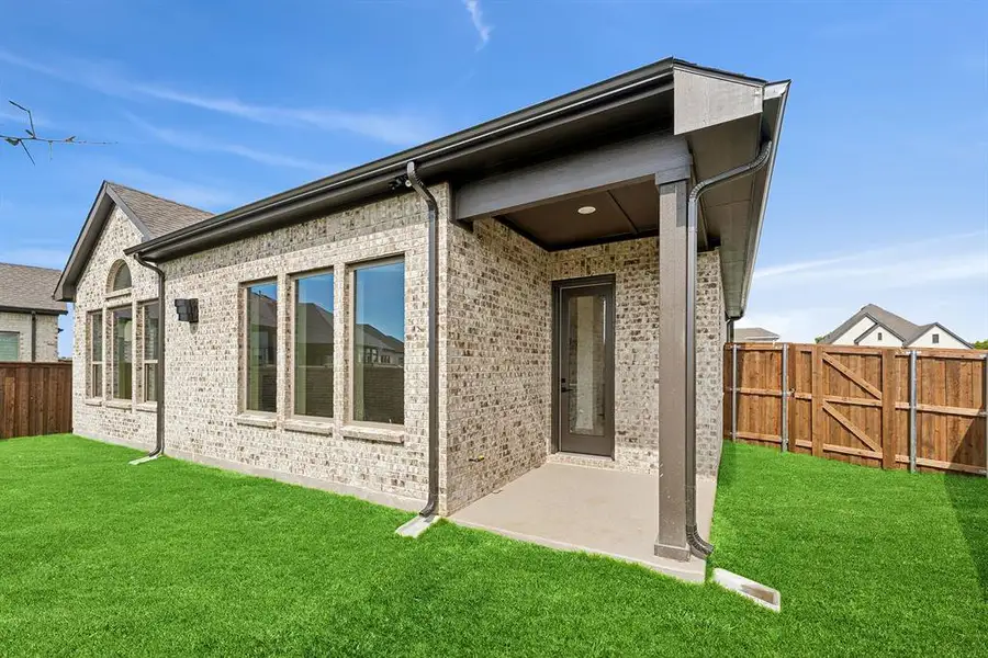 Exterior details and patio area of a home in South Pointe Cottage Series, Mansfield (Image 3). Exterior details and patio area of a home in South Pointe Cottage Series, Mansfield (Image 3).