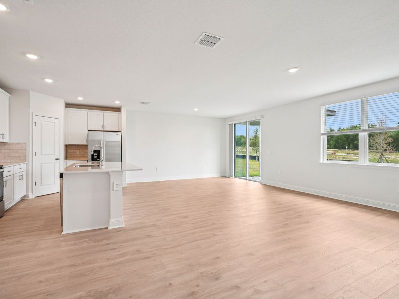 Spacious, unfurnished interior of a new home in The Reserve at Hammock Oaks - Signature Series, Lady Lake (Image 10).