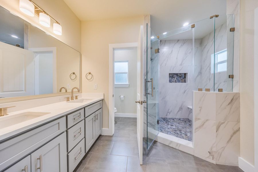 Luxurious, oversized bathroom with elegant finishes, soaking tub, and walk-in shower. Treat yourself to daily comfort! Luxurious, oversized bathroom with elegant finishes, soaking tub, and walk-in shower. Treat yourself to daily comfort!